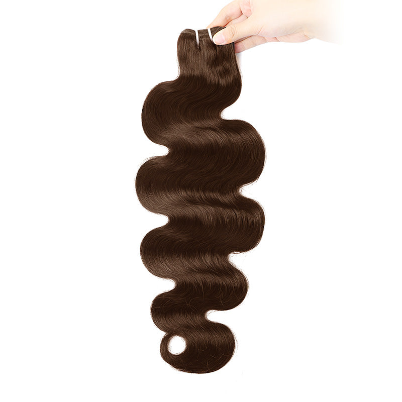 Brown Human Hair Bundle Held By A Hand On A White Background