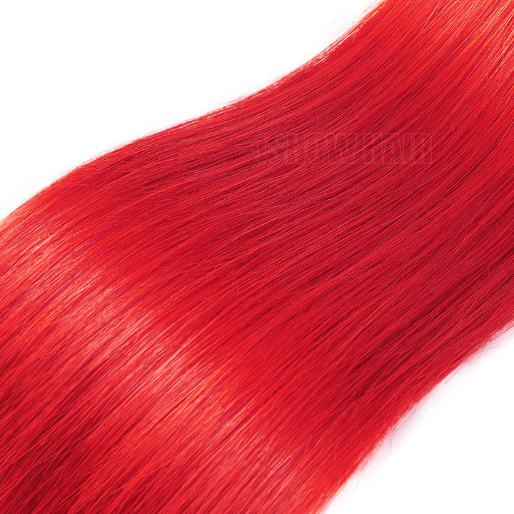 A Close-Up Of Red Hair Bundles Falling Diagonally Across A White Background.