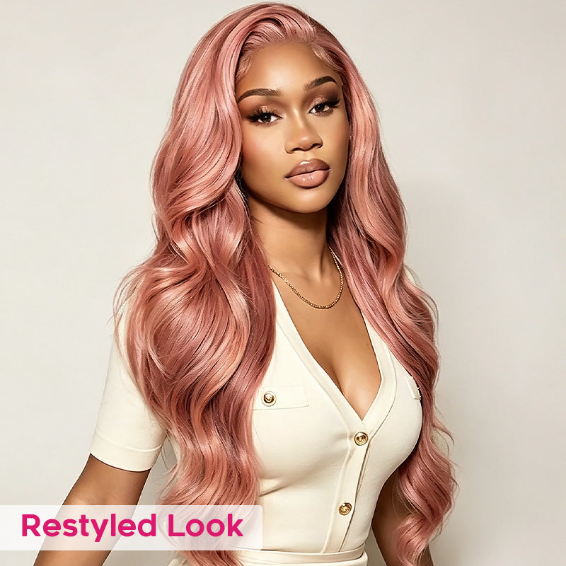 A Woman Modeling A Long Pink Color Hair , Wearing A Cream-Colored Top Against A Light Gray Background. A Pink Banner At The Bottom Left Reads 'restyled Look'.
