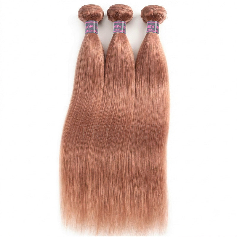 Three Bundles Of Straight, Silky Hair Extensions In A Pink Shade, Displayed Side-By-Side Against A Plain White Background.