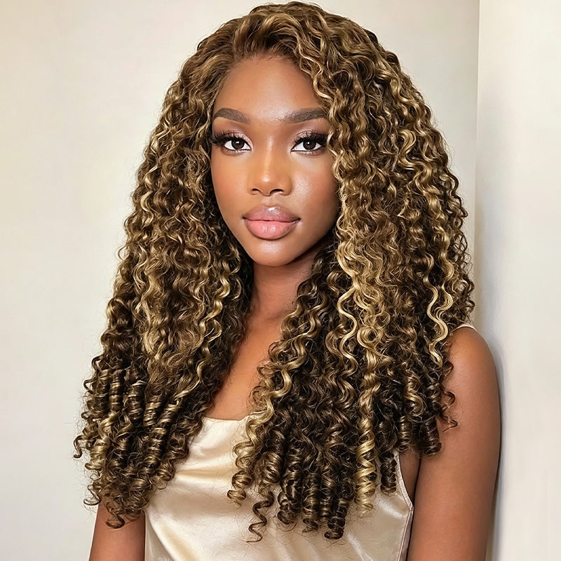 A Woman With Burmese Curly Hair Wig In A Dark Brown To Light Brown Ombre Style, Wearing A Champagne-Colored Satin Top Against A Plain Off-White Background.
