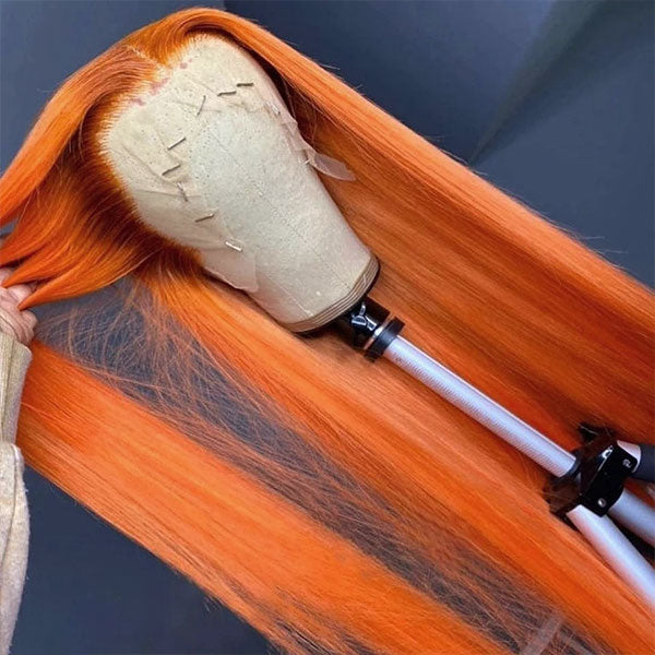 Ginger Orange Lace Front Wig On a Stand, Highlighting Its Vibrant Straight Hair